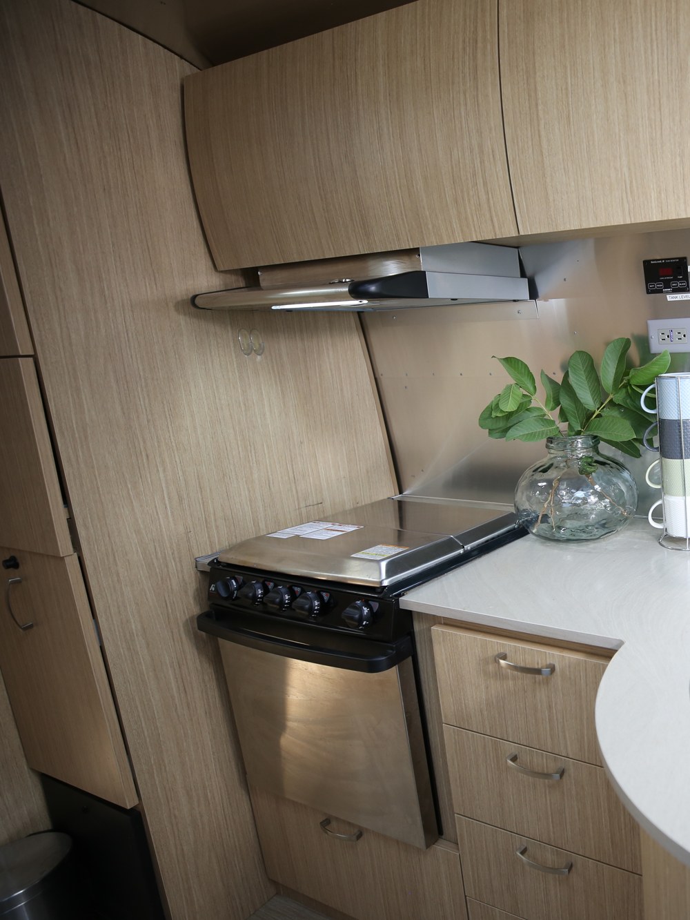 The Airstream lounge's kitchen with cooktop and oven